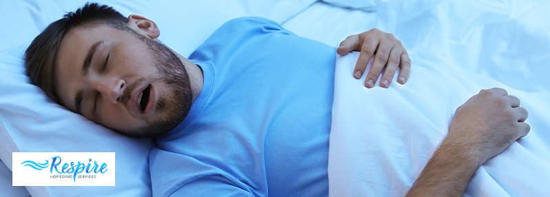 Man snoring with his mouth open in bed