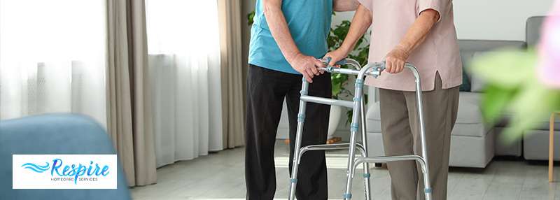 Elderly couple in home, one of them is using a walker