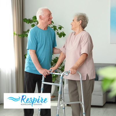 Elderly couple in home, one of them is using a walker