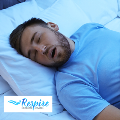 Man snoring with his mouth open in bed